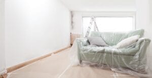 empty,home,room,under,renovation,with,white,wall,,ladder,and