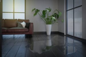 water,leaking,and,flooded,on,wood,parquet,floor.