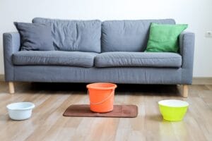 variety,of,containers,arranged,on,the,wooden,floor,of,house.