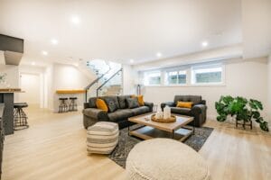 recreation,party,room,with,bar,stairs,with,glass,rails,downstairs